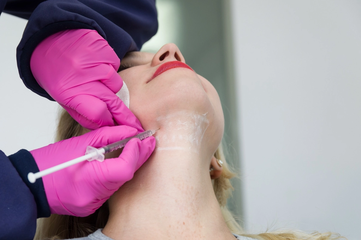 Woman Receiving Kybella Injection at Eros Beauty and Wellness